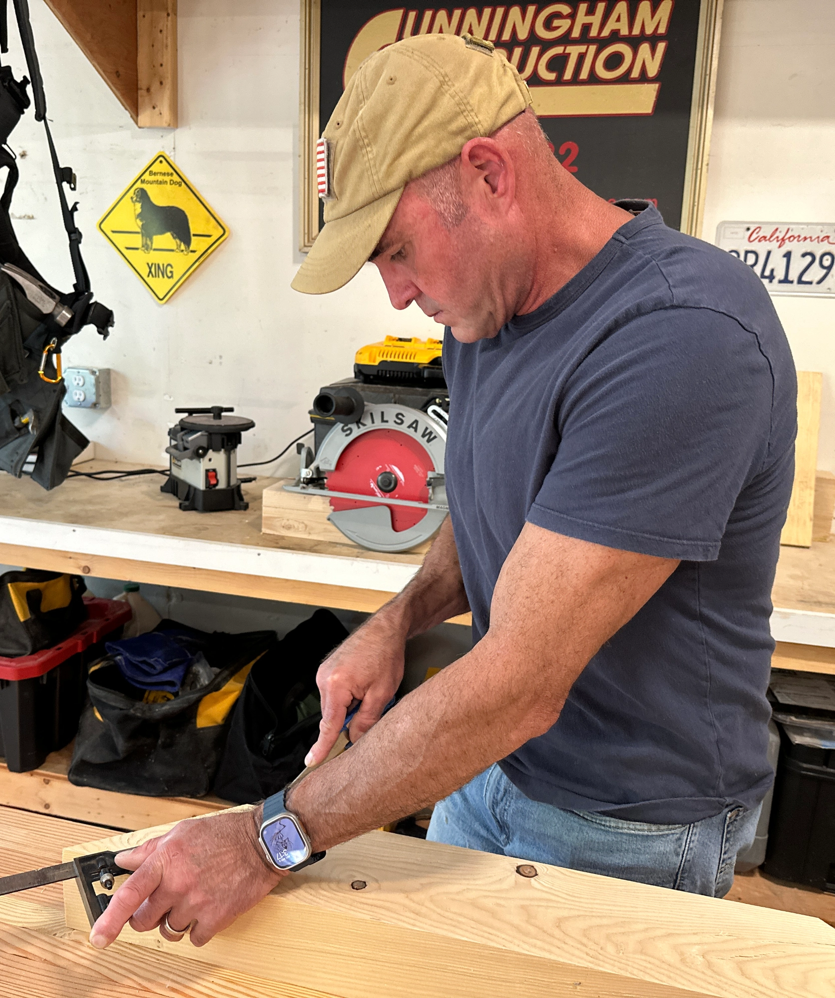image of Bob Cunningham Professional Builder working on custom post and beam pergola for outdoor backyard